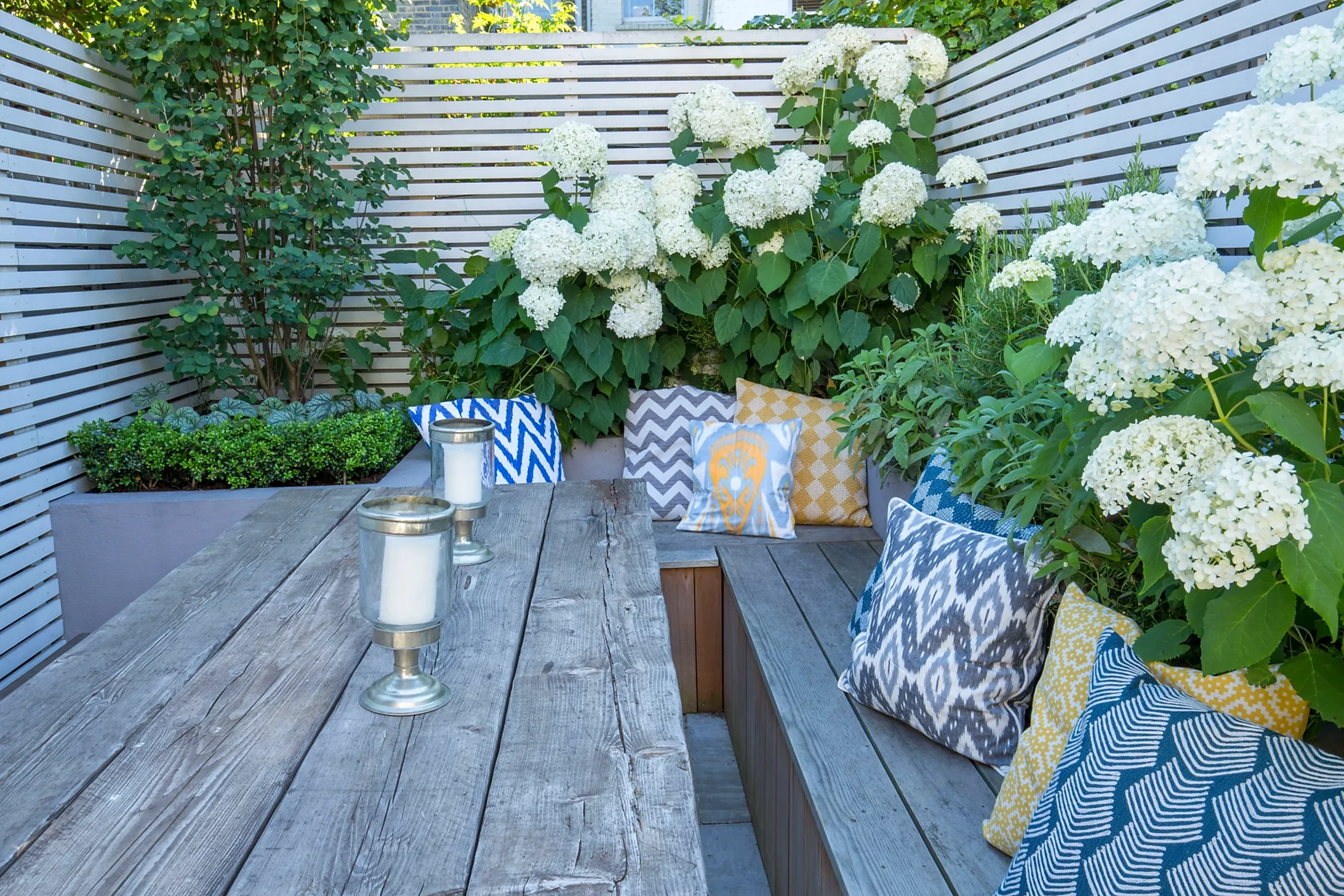 a table with pillows and candles on it