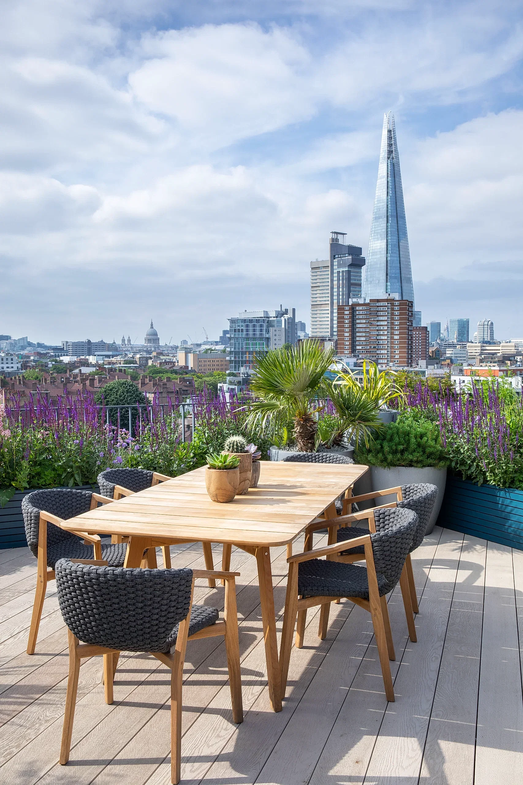 London roof terrace with planters and dining area