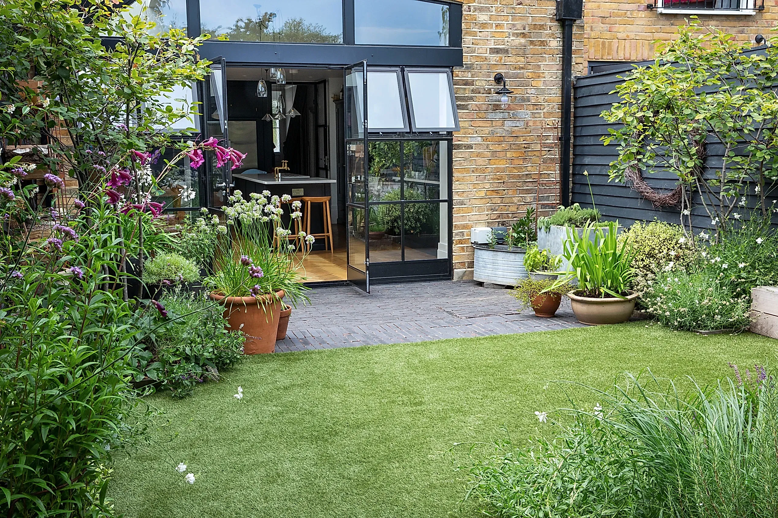 a house with a patio and a lawn