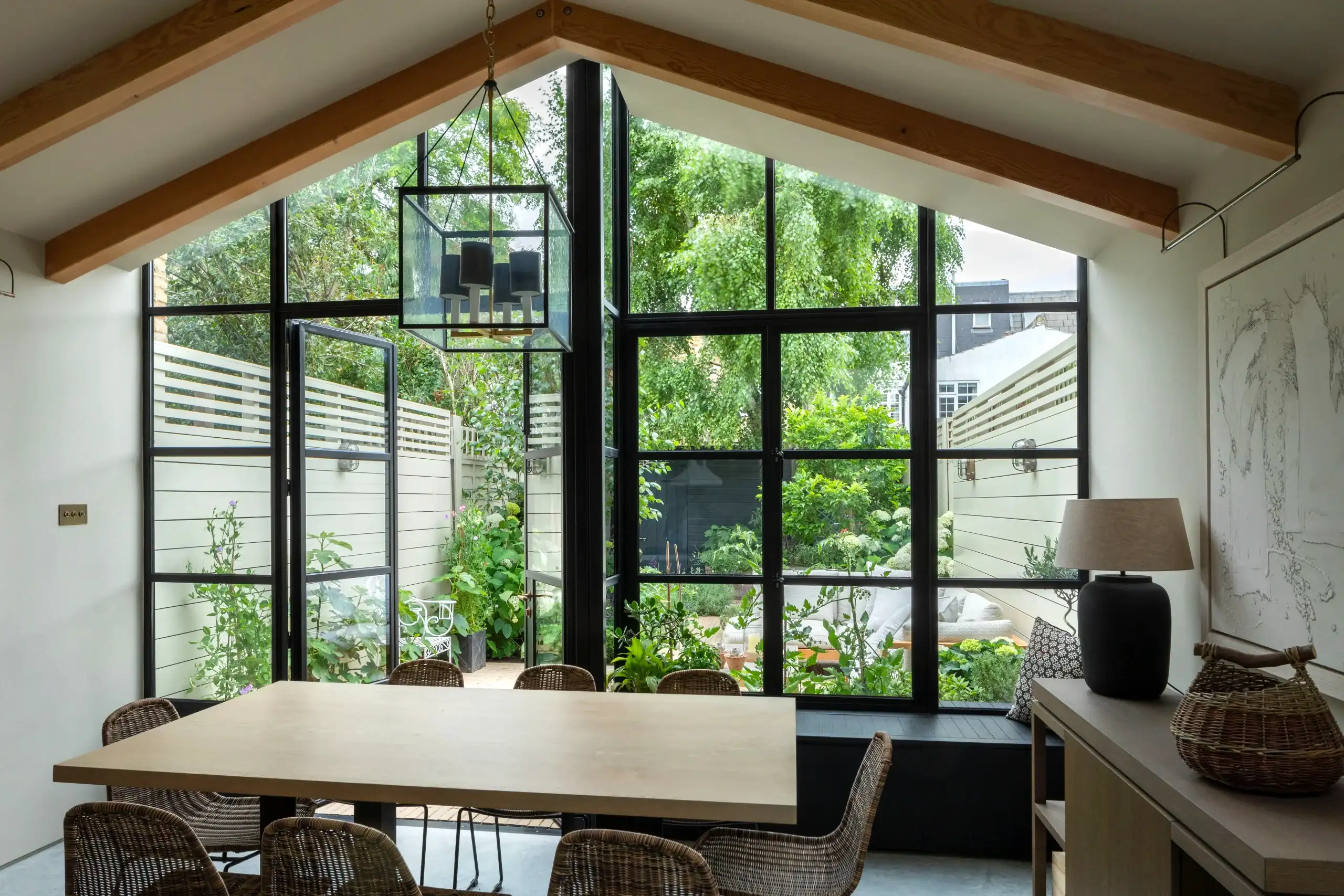 Kitchen extension in Fulham with garden design in neutral tones