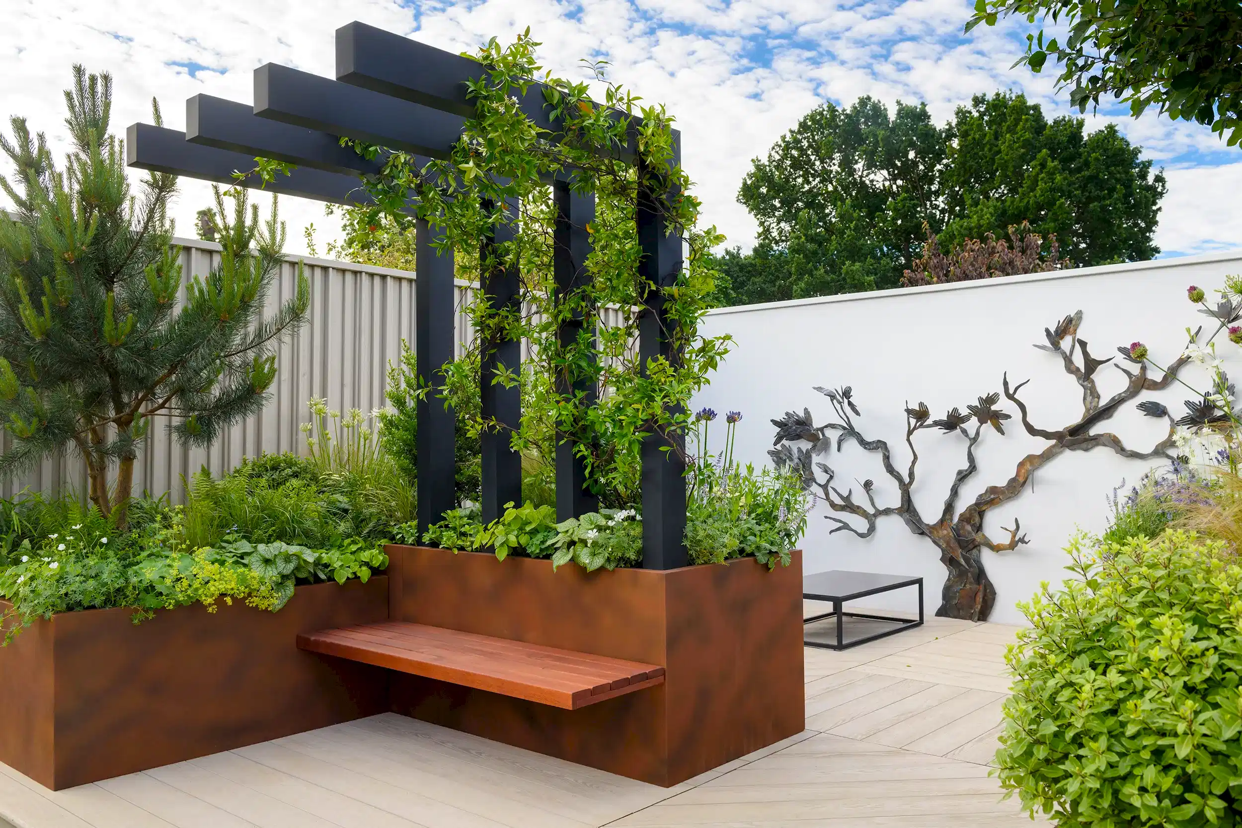 Garden design for a hospital roof garden with pergola, seating and planting