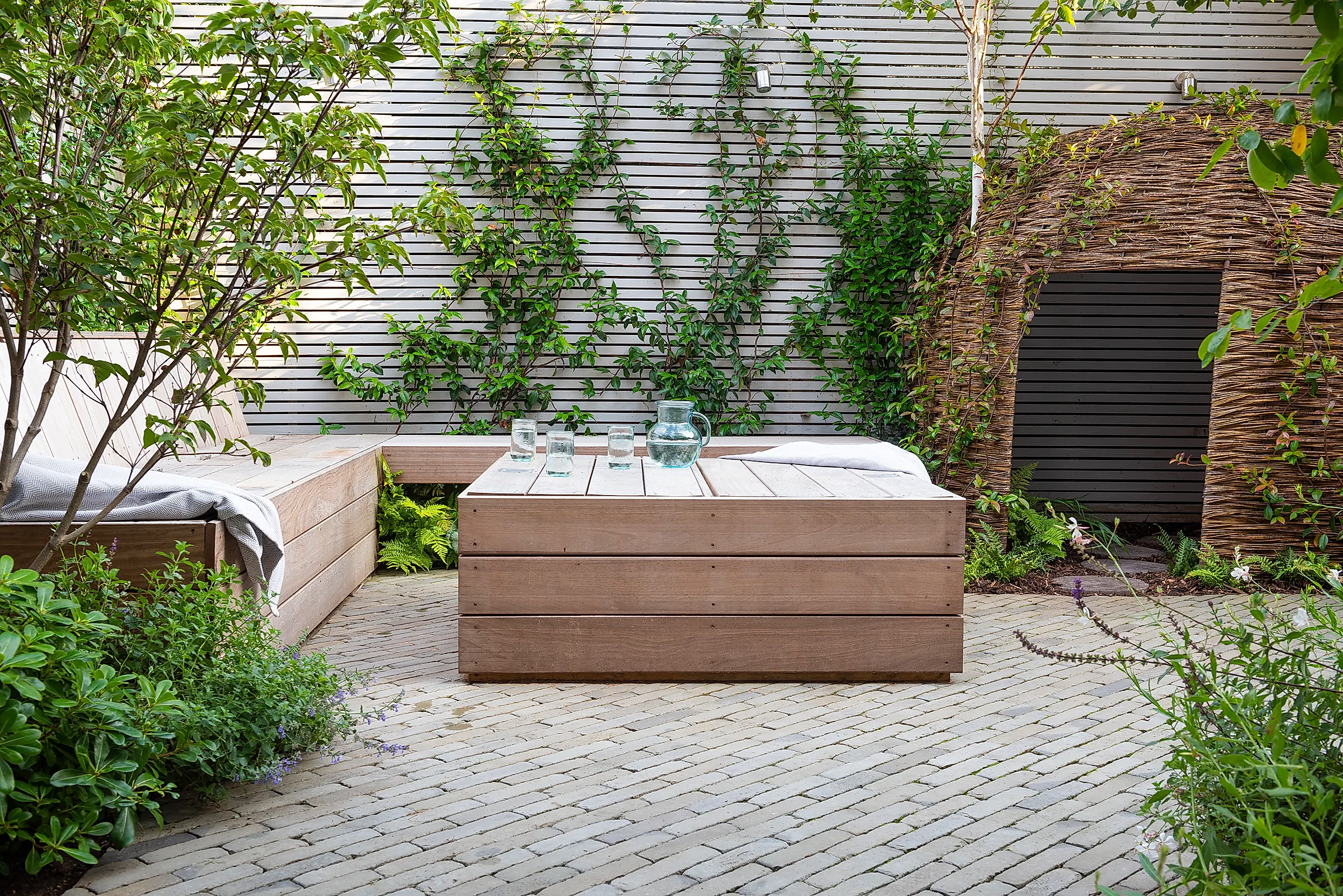 a wooden table with glass jars on top of it