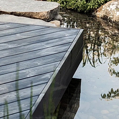 Garden design with pond with deck and stepping stones