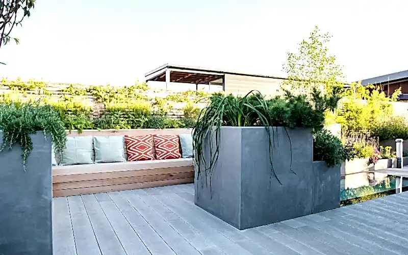 a bench and planter on a deck