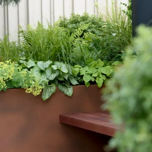 a planter box with plants in it