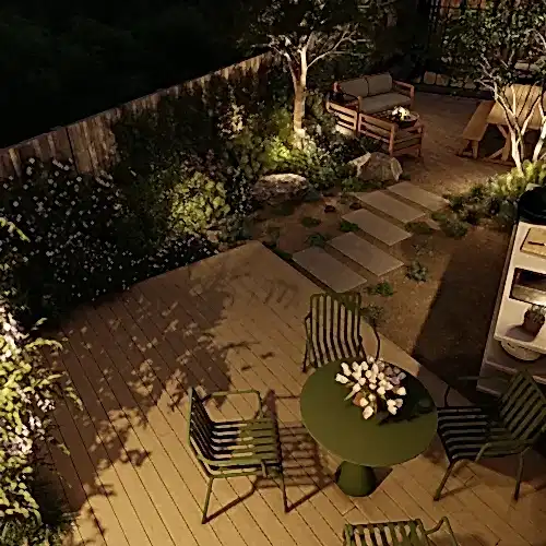 Garden design on the coast with beach style planting and outdoor kitchen at night