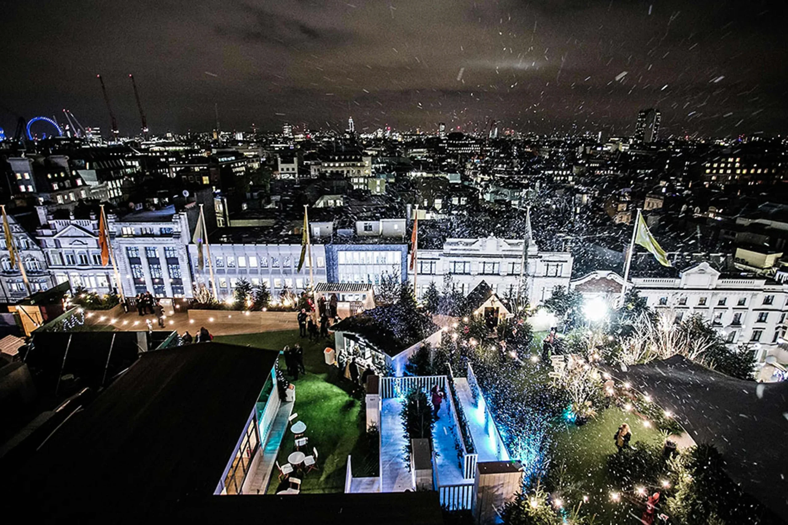 a rooftop view of a city at night