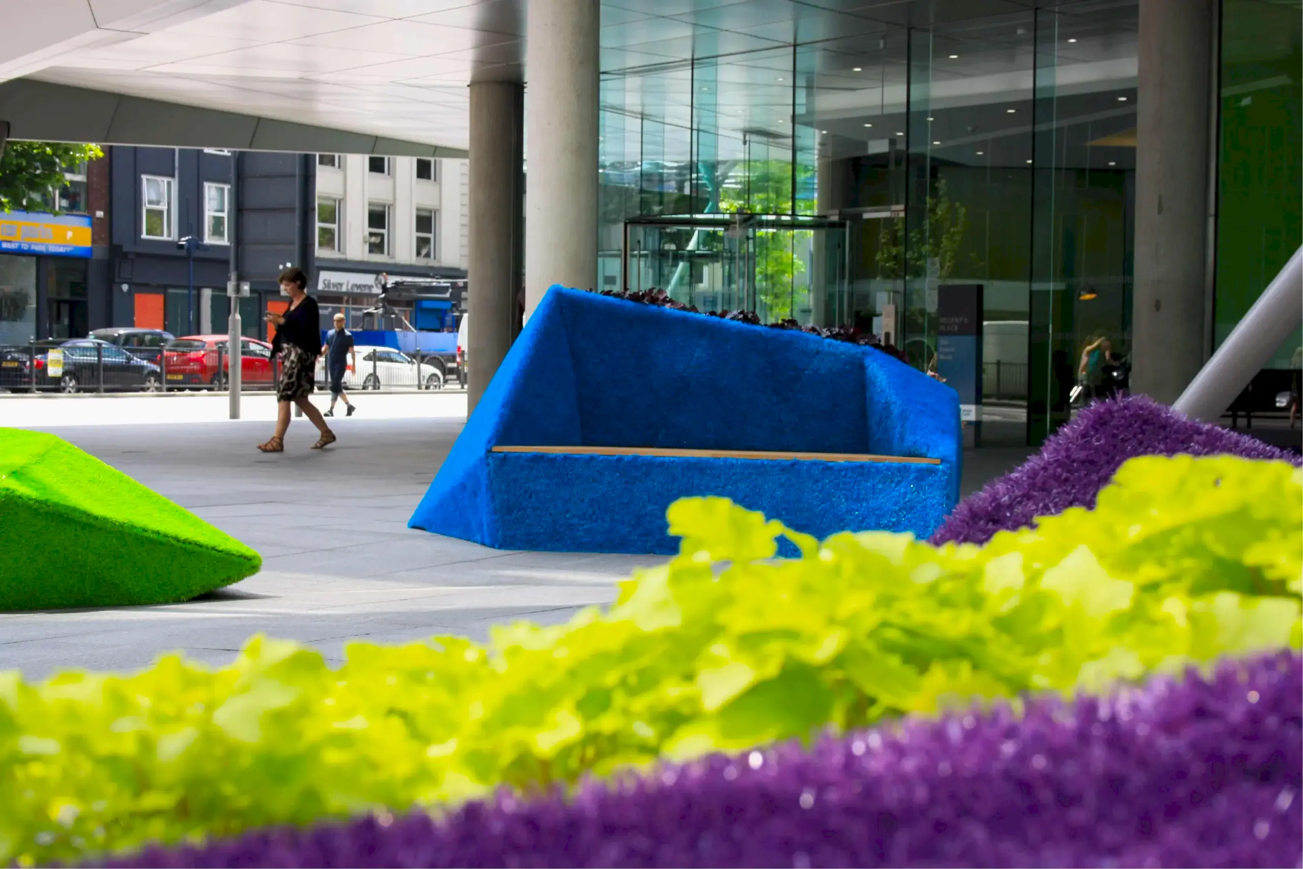 a blue couch in front of a building