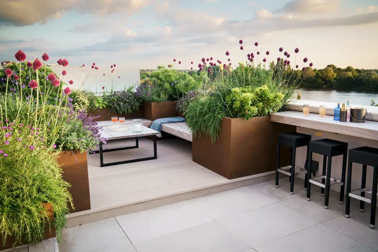 a patio with plants and tables